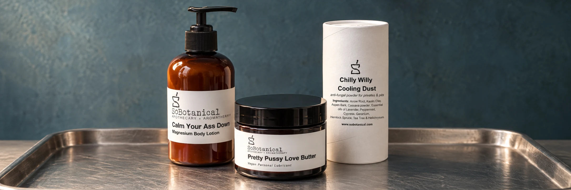 Calm Your Ass Down Magnesium Body Lotion, Pretty Pussy Love Butter and Chilly Willy Cooling Dust on brushed metal