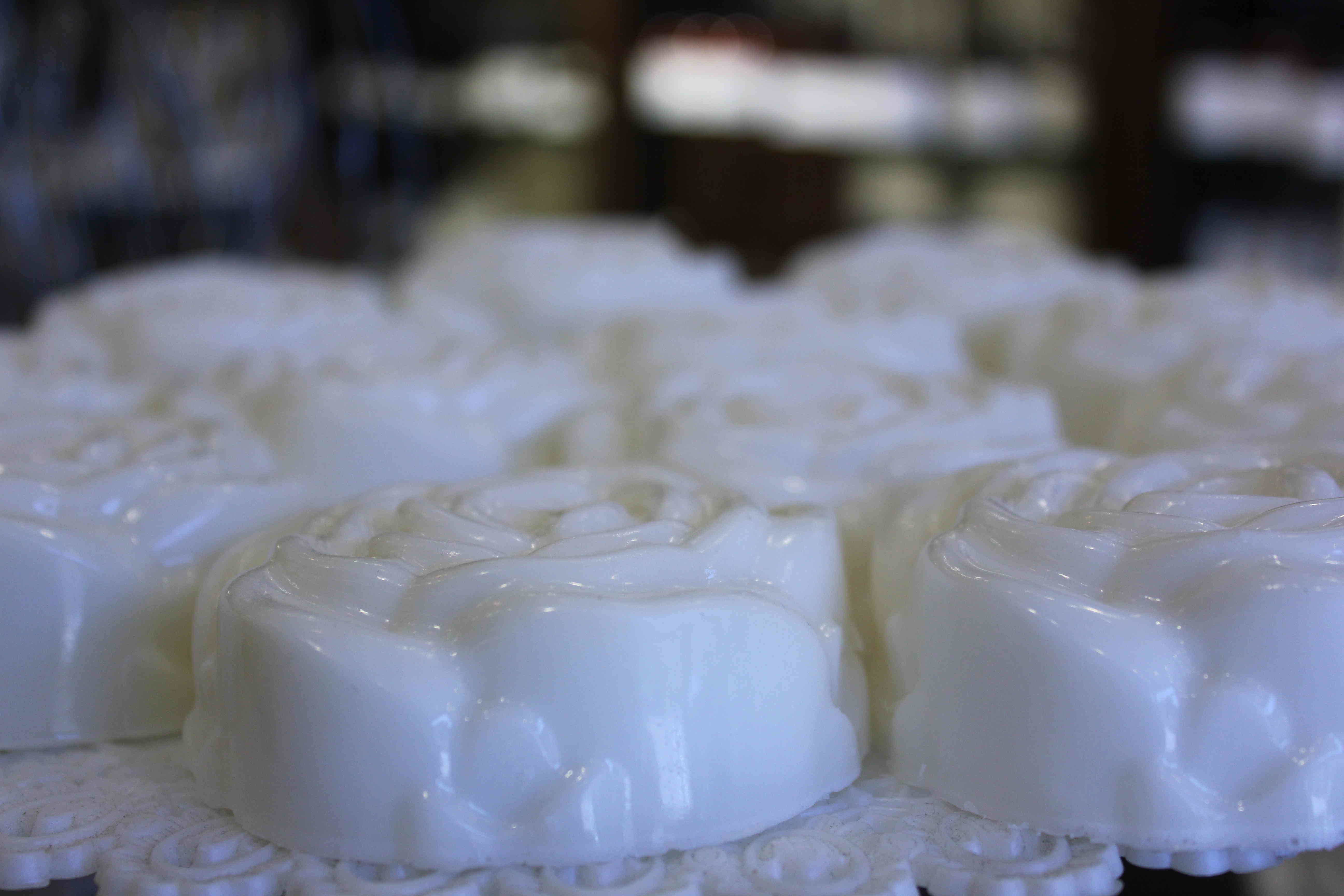 Close-up of white rose-shaped soaps at the apothecary
