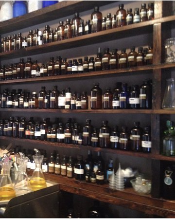 The oil wall above the blending bar at the Roland Park studio